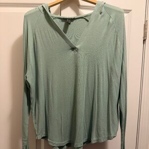 green hooded shirt